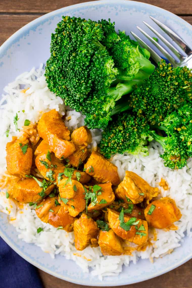 Coconut Curry Chicken with Broccoli on a light blue plate