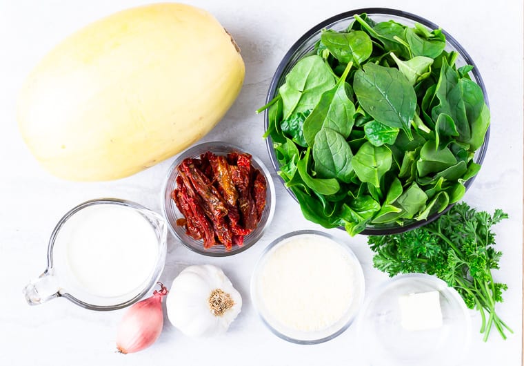 Ingredients needed for Tuscan Spaghetti Squash on a white background