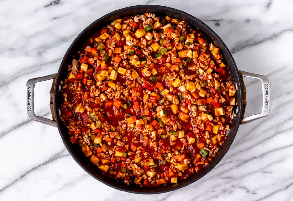 Spaghetti sauce with meat and vegetables in a skillet.