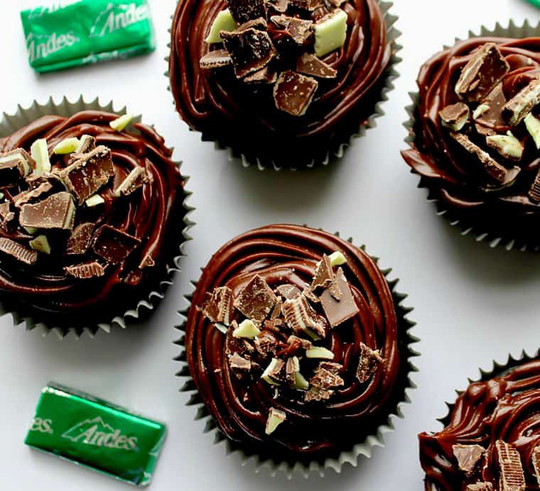 Chocolate cupcakes topped with chopped up mint chocolate candies