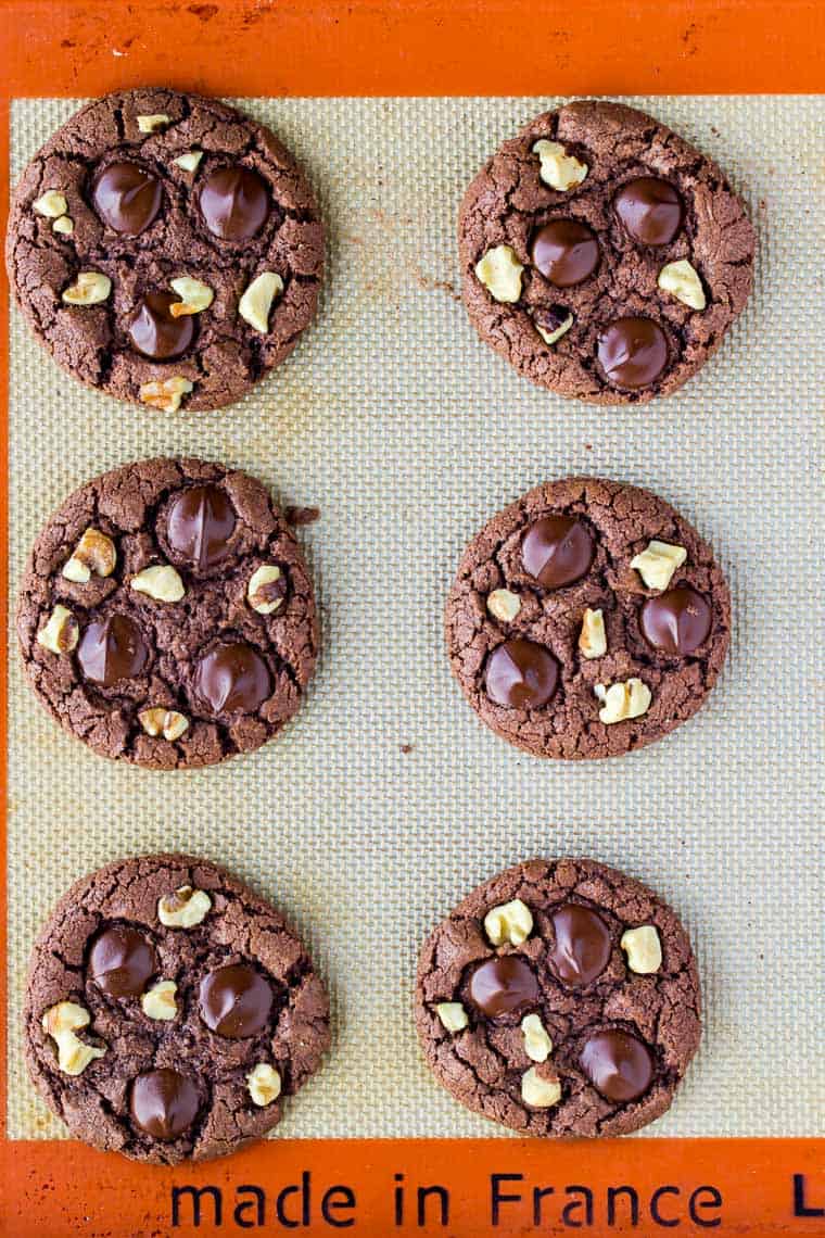 6 Chocolate Cookies with Walnuts and Chocolate Chips Baked on a Silpat Mat