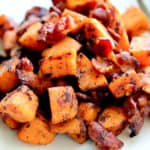 Maple Bacon Sweet Potato Hash on a White Plate with a Fork