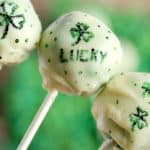 Close Up of Decorations on 3 white chocolate covered cake pops