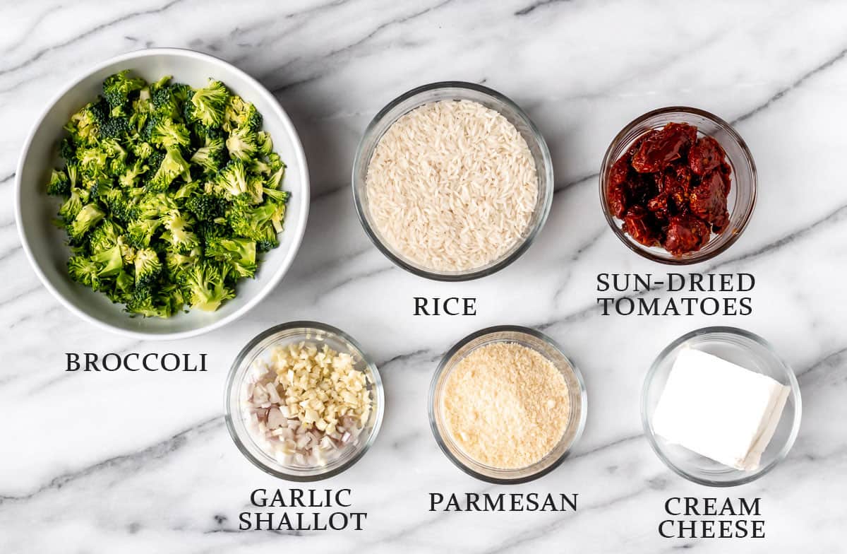 Ingredients needed to make cream cheese rice with broccoli and sun-dried tomatoes on a marble table with text overlay.