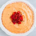 Roasted Red Pepper Spread in a white serving dish on a white background