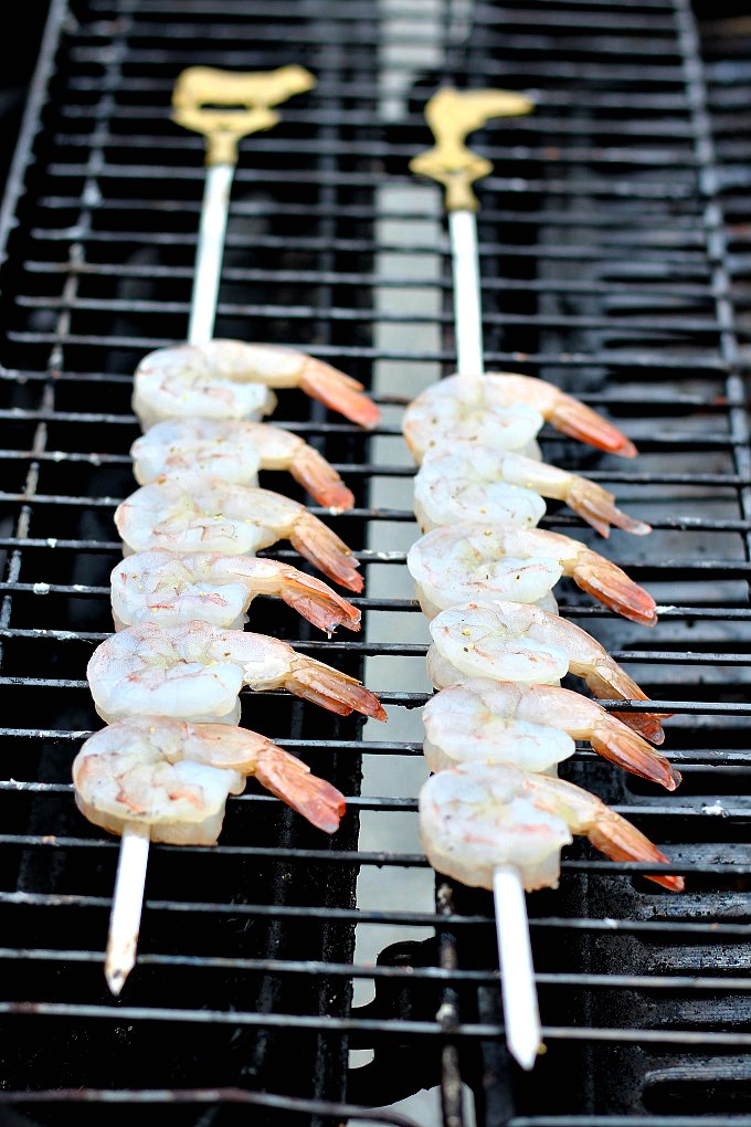 2 Shrimp On Skewers on a grill