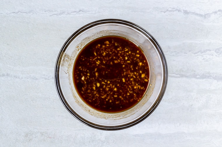 sesame sauce in a glass bowl over a white background