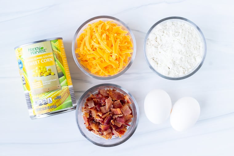 Ingredients for corn fritters on a white background