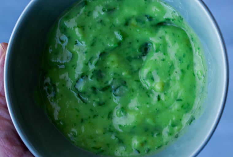 Cilantro Lime Avocado Dressing in a Small Green Bowl