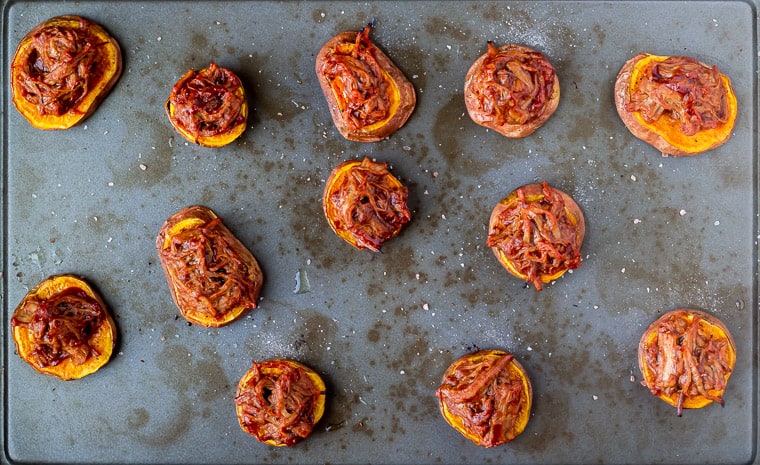 Roasted sweet potato rounds with barbecue pulled pork on top