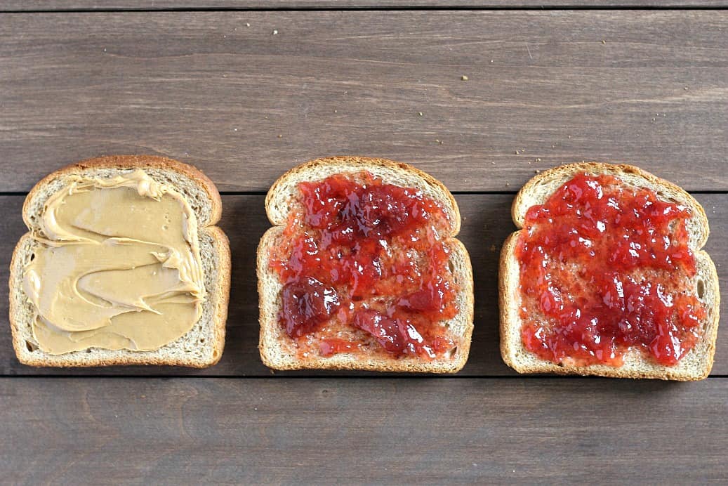 Bread Slices with Peanut Butter and Jelly on Them