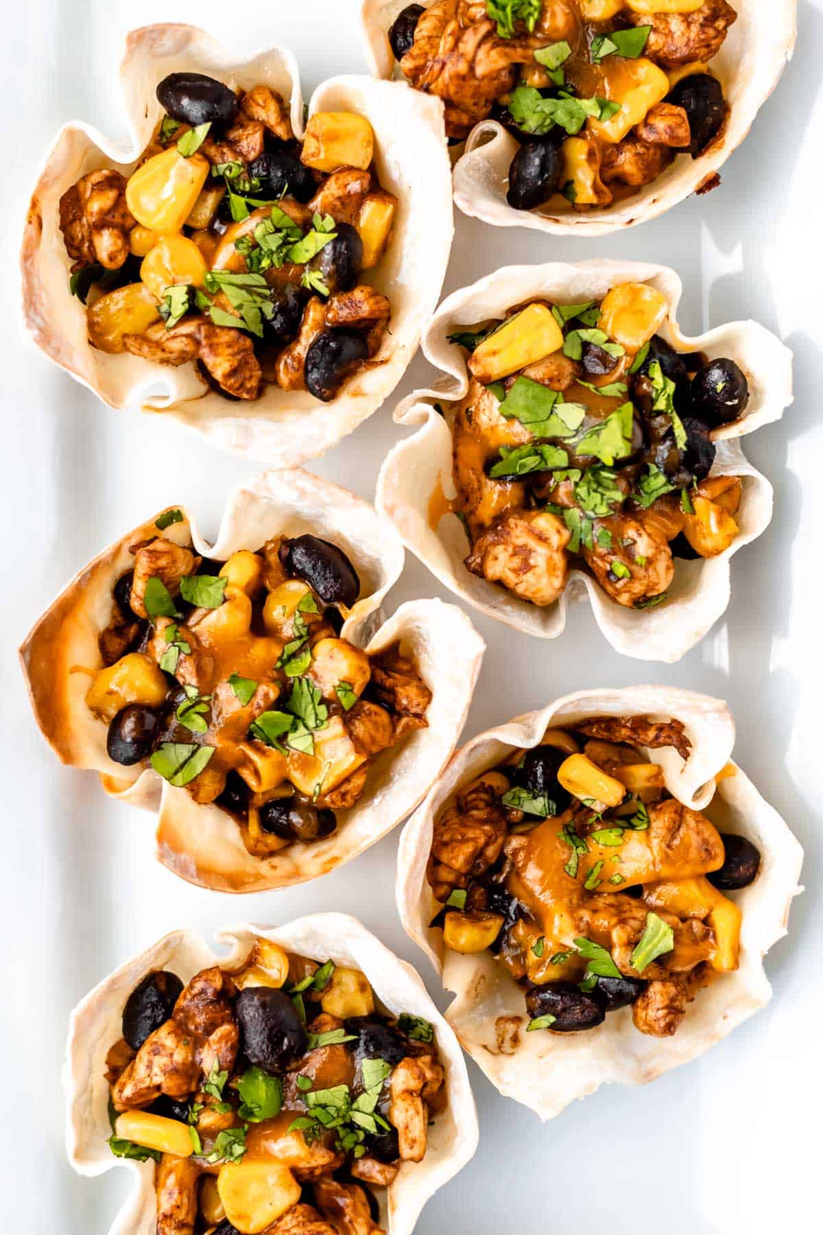 Overhead of Southwestern Chicken Wonton Cups on a white serving tray.