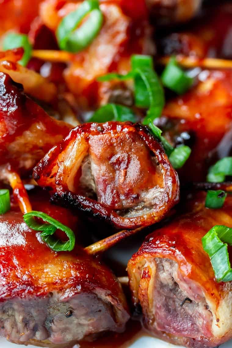 Close up of barbecue bacon wrapped beef bites with green onions 