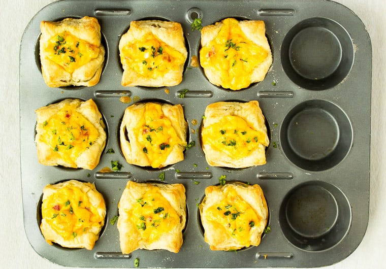 9 Breakfast Puff Pastry Cups baked in a cupcake pan