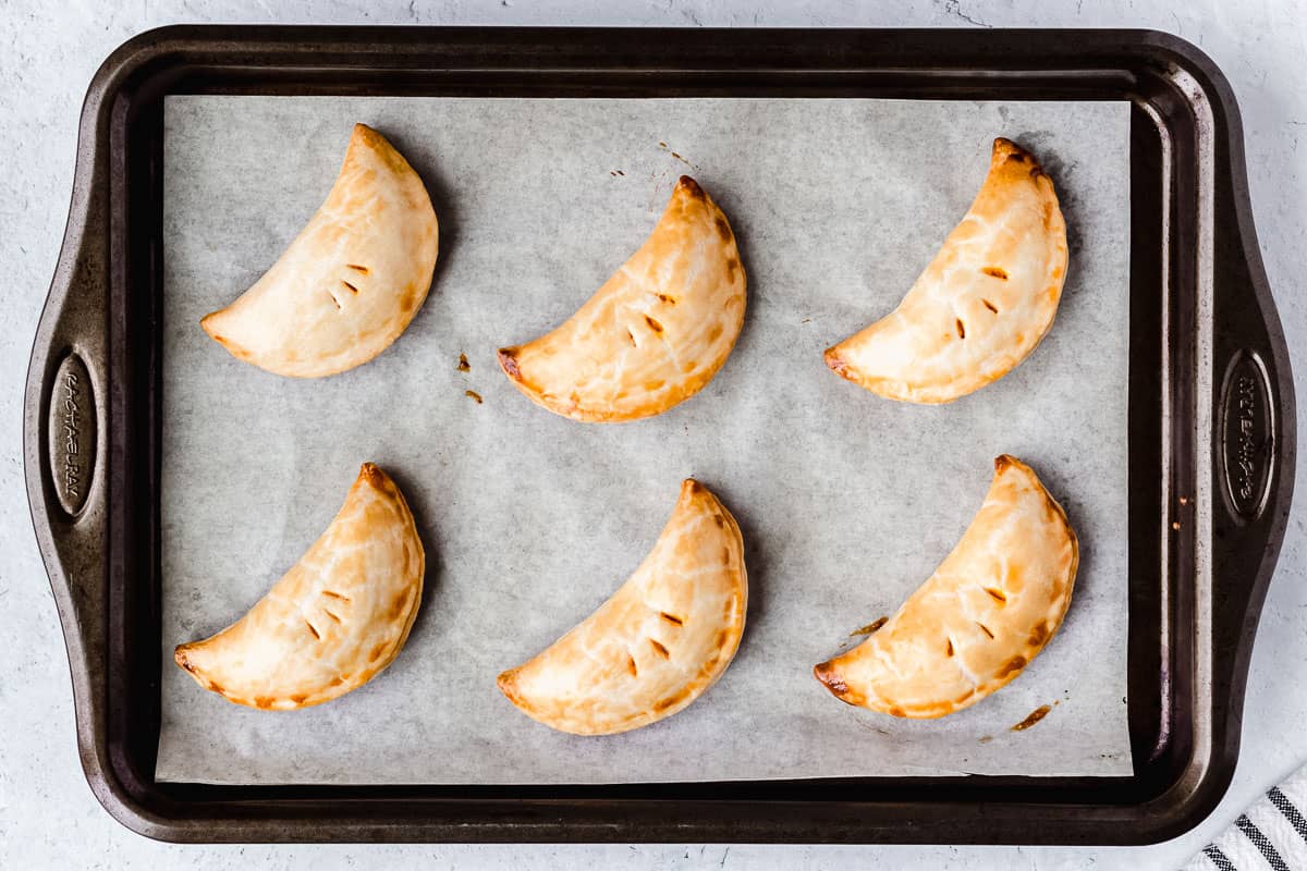 Baked hand pies on a baking sheet