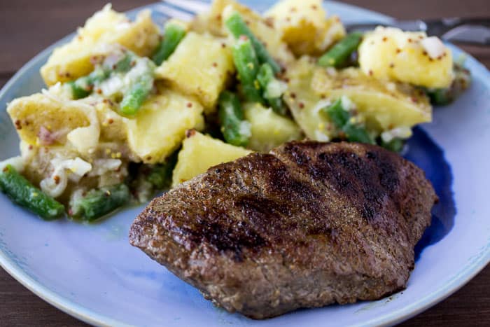 Steak and Potatoes Meal on a Blue Plate