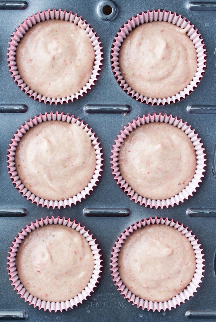 overhead view of strawberry Cupcake Batter in a Cupcake Pan with liners