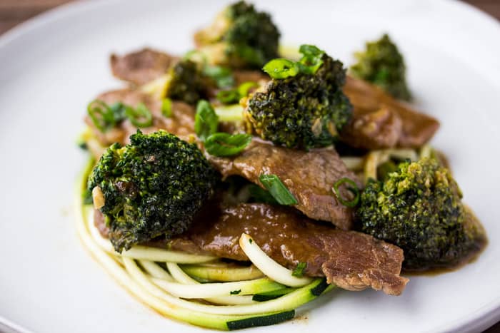 Low Carb Beef & Broccoli Zoodles up close on a white plate