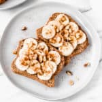 2 slices of banana toast with cinnamon, brown sugar and walnuts