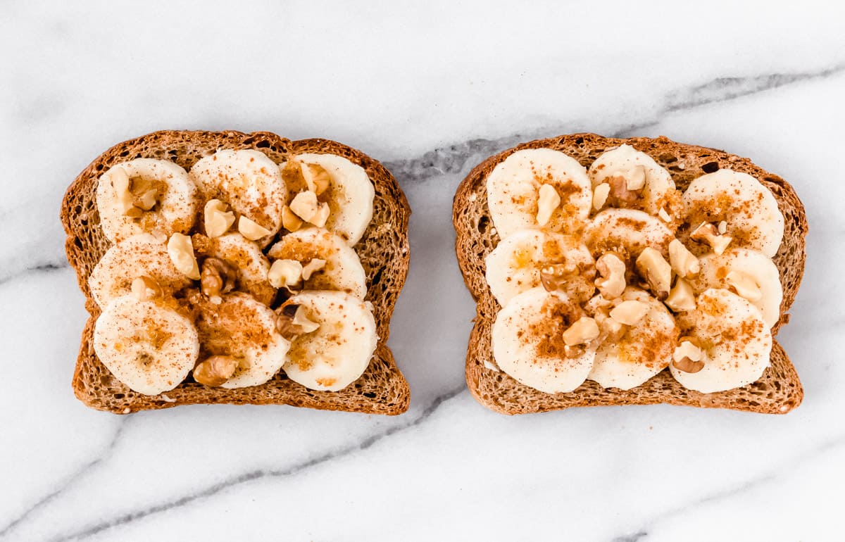 Toast with banana slices topped with brown sugar, cinnamon and chopped nuts on top