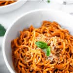 Carrot noodles with pesto and text overlay.