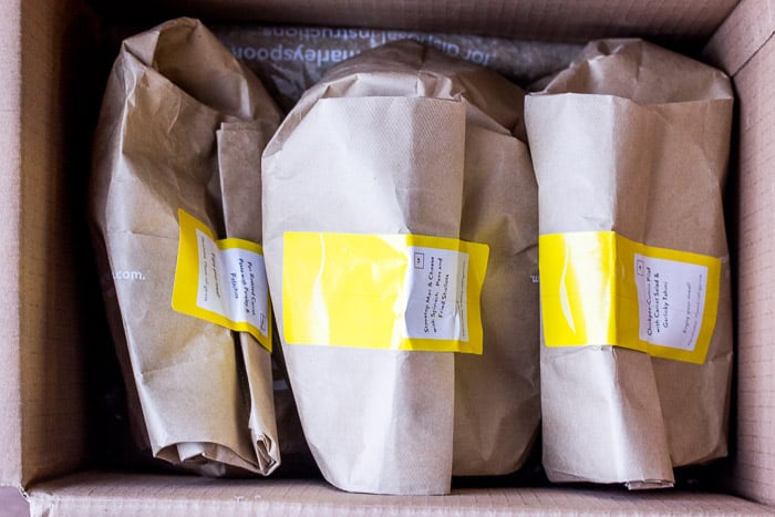 3 Brown Bags Containing Ingredients for the Recipes in a Box
