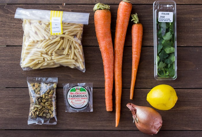 Ingredients for the Pan Roasted Carrot Pasta Laid Out on a Wood Board