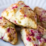 Stack of White Chocolate Raspberry Scones on a White Plate