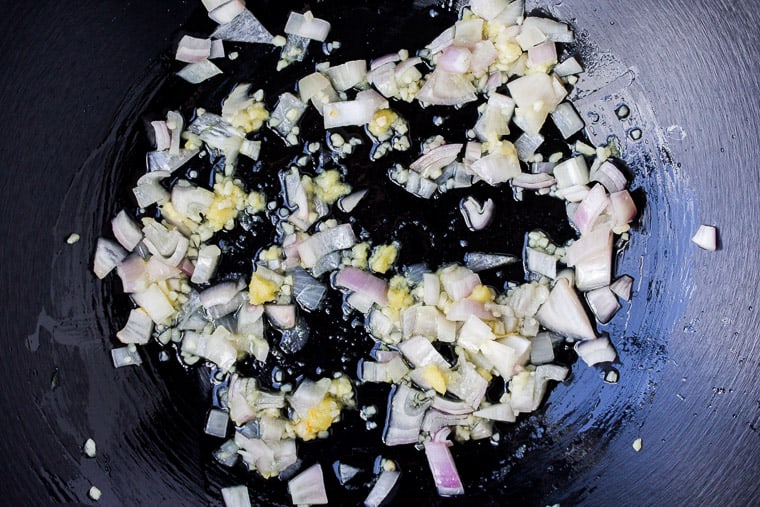 Garlic, Ginger, and Shallot Cooking in a Skillet