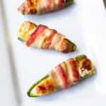 Extreme bacon jalapeno poppers on a white tray