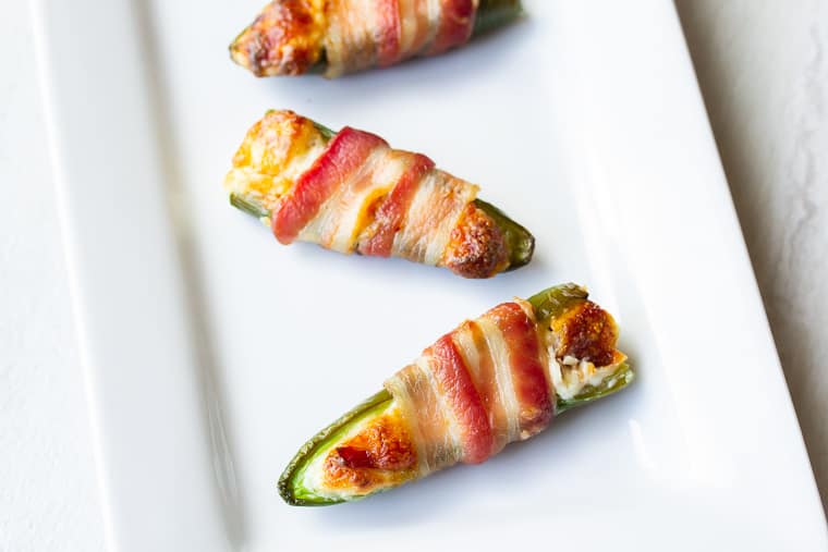 Extreme bacon jalapeno poppers on a white tray
