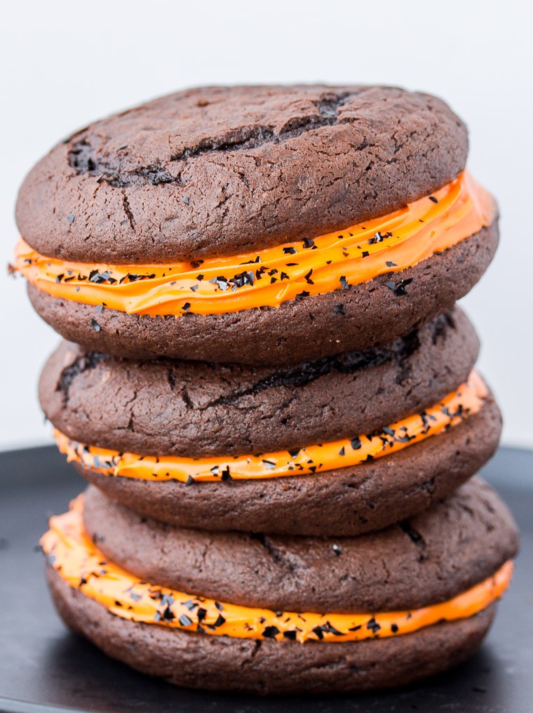 Halloween Whoopie Pies Stacked 3 High on a Black Plate over a white background