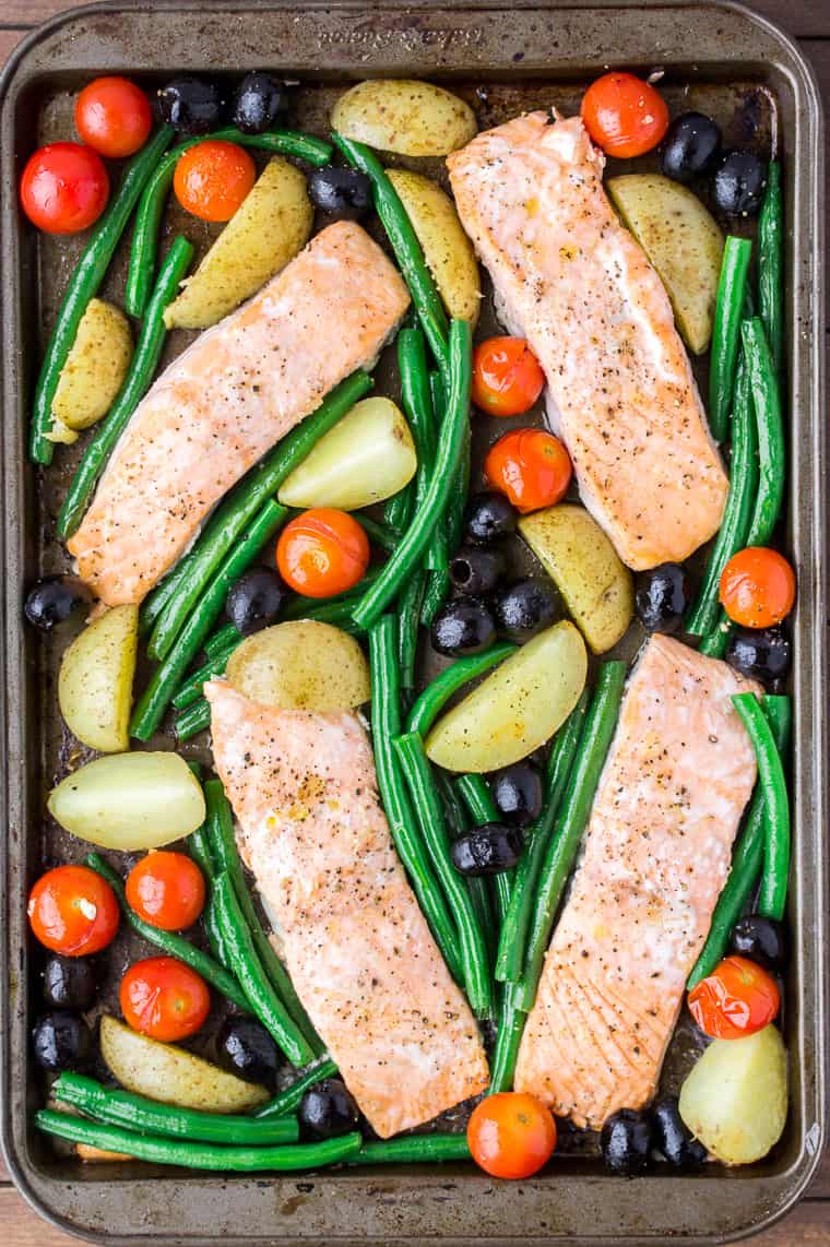 Baked Salmon and Vegetables Mixed Together on a Sheet Pan