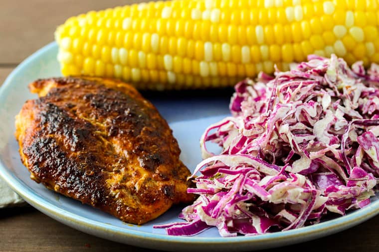Blue Apron Spicy Chicken and Honey Butter Corn on a Blue Plate with Coleslaw
