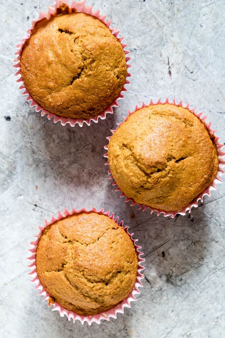 3 Butternut Squash Muffins on a Gray Backdrop