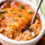 barbecue chicken dip with a spoon in it and text overlay