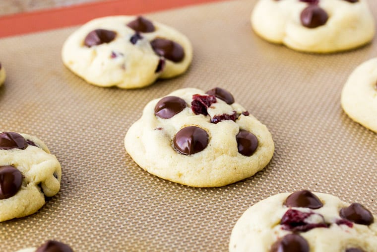 Baked Dark Chocolate Chip Cranberry Cookies on a Silpat Mat