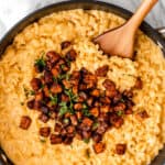 Sweet potato mac and cheese in a skillet with text overlay.