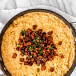 Sweet potato mac and cheese in a skillet with text overlay.