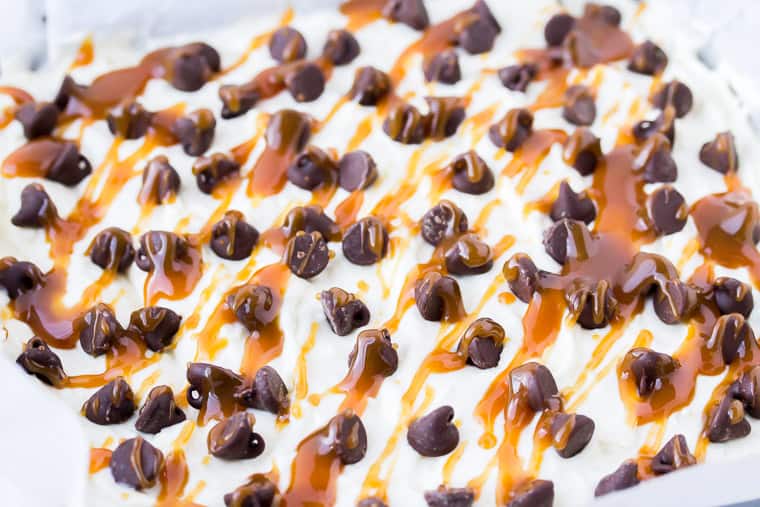 No Bake Coconut Cheesecake Topped with Chocolate Chips and Salted Caramel Sauce