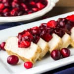 Pork Tenderloin with Cranberry Apple Chutney on a White Serving Tray
