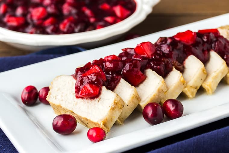 Pork Tenderloin with Cranberry Apple Chutney on a White Serving Tray 