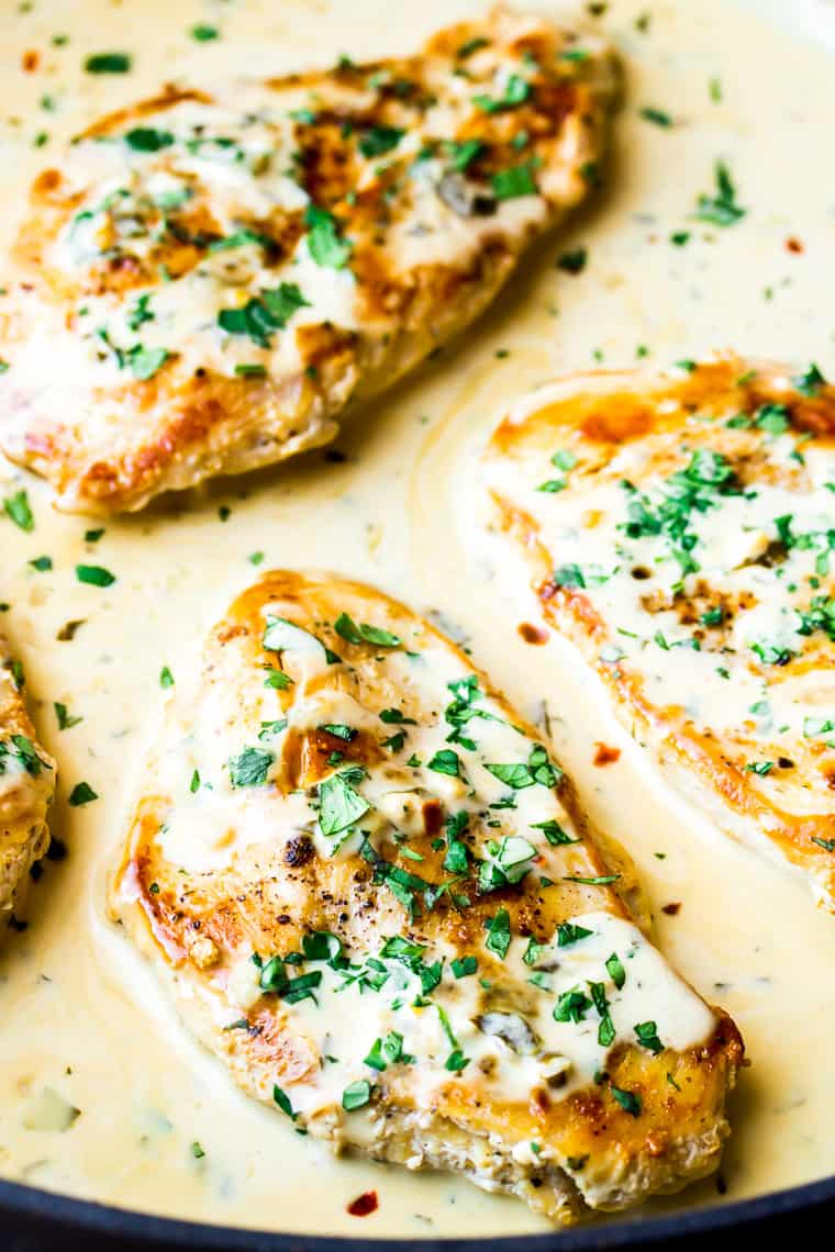 Close Up of the 3 Creamy Cilantro Lime Chicken Breasts Topped with Extra Sauce and Cilantro