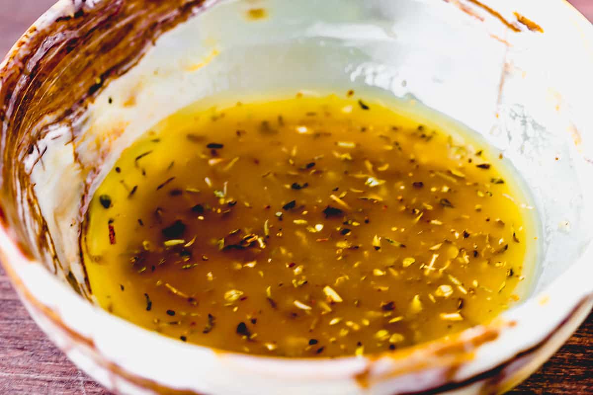 Greek salad dressing in a small bowl up close