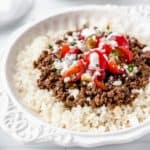 Close up of keto mexican beef bowls in a white dish over a white background