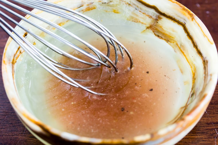 Sherry Vinaigrette in a Small Tan bowl with a small whisk