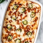 A jalapeno popper chicken casserole with text overlay.