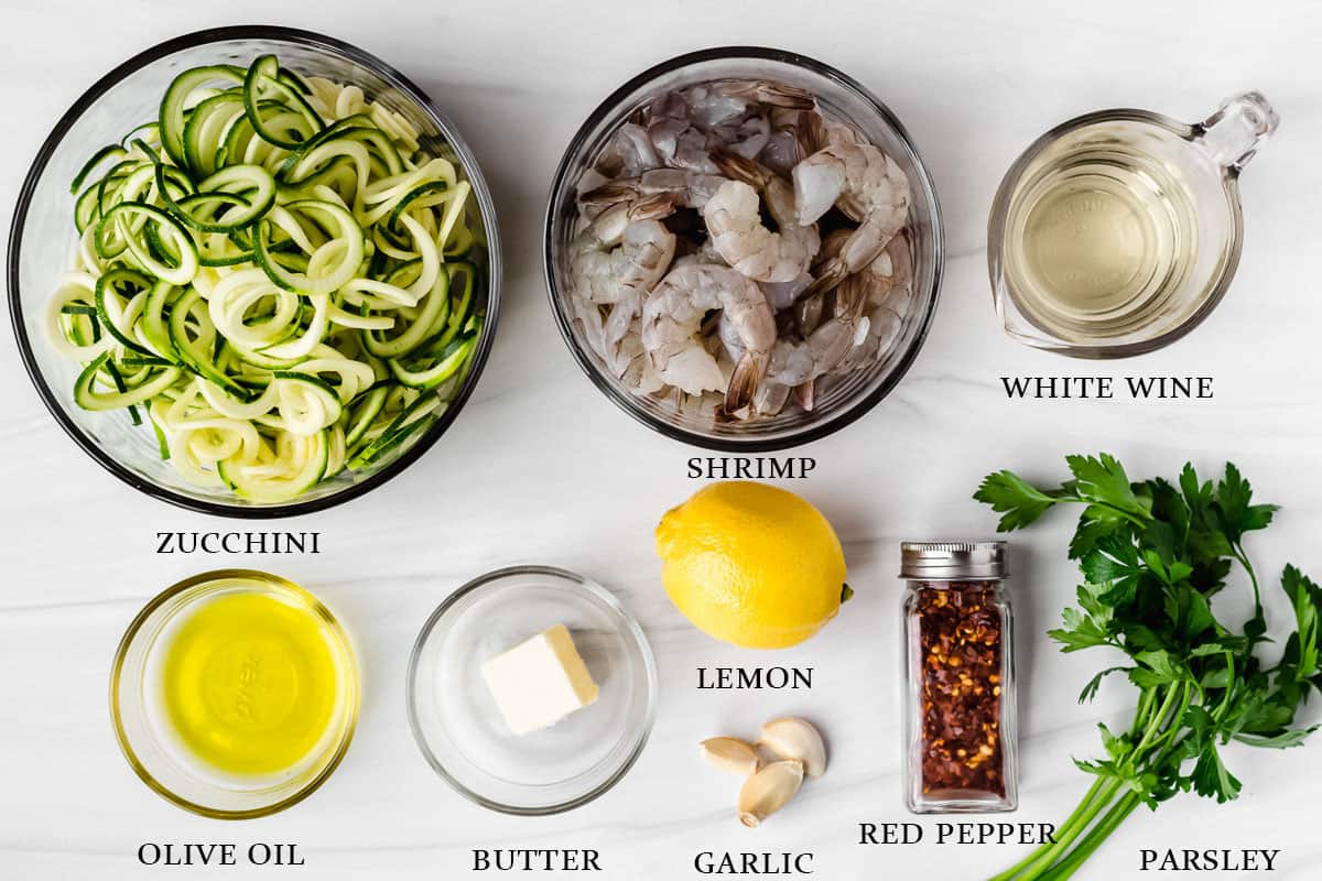 ingredients to make keto shrimp scampi on a white background with labels