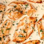 Close up of creamy cilantro lime chicken with text overlay.