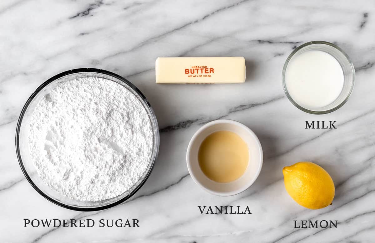 Ingredients to make lemon buttercream frosting with text overlay.
